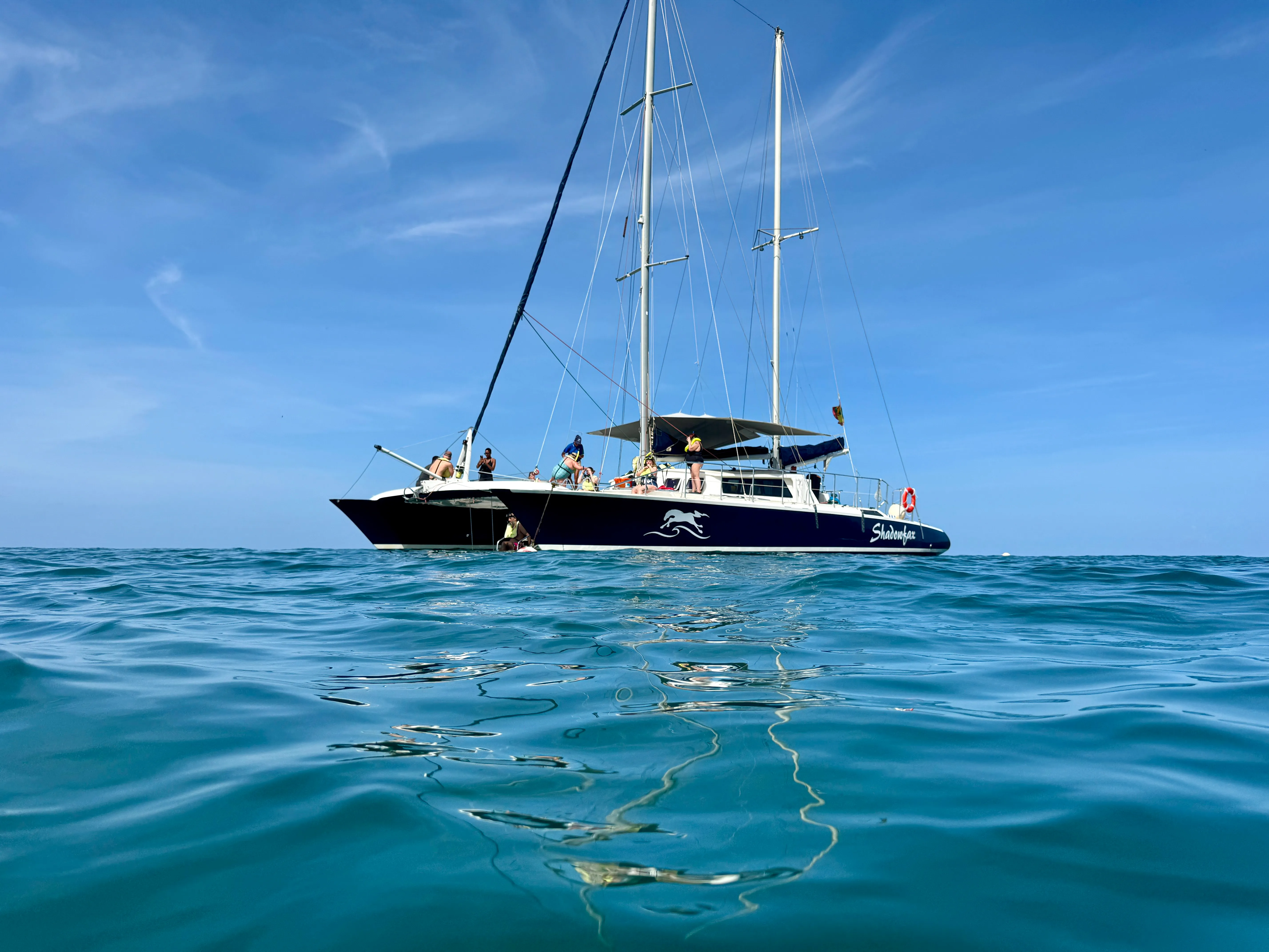 A small boat on calm clear water off the west coast of Grenada