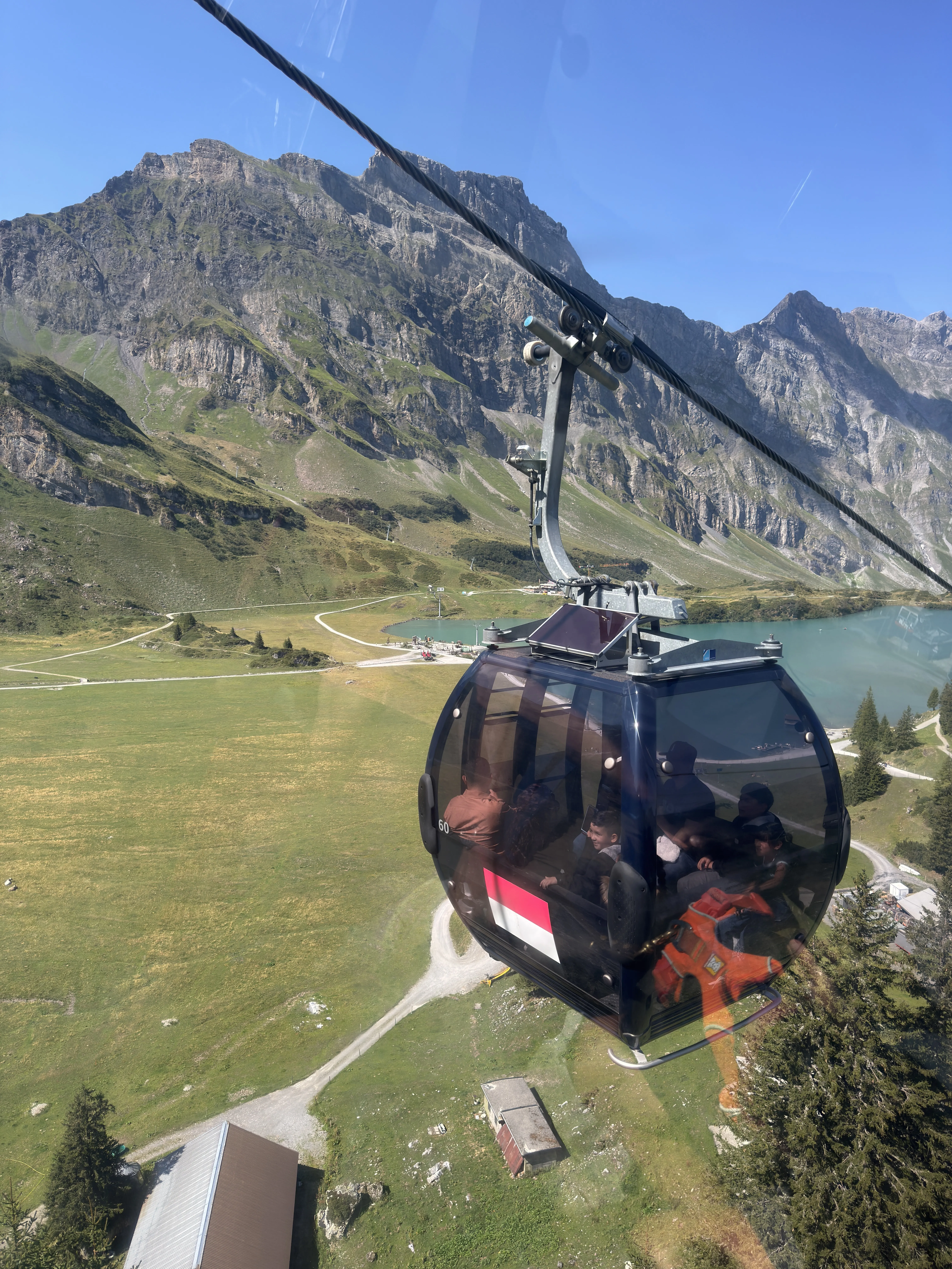 The Titlis Rotair revolving cable car climbing towards the glacier and summit above Engelberg