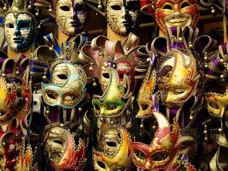 Colourful traditional Venetian carnival masks displayed in a shop window